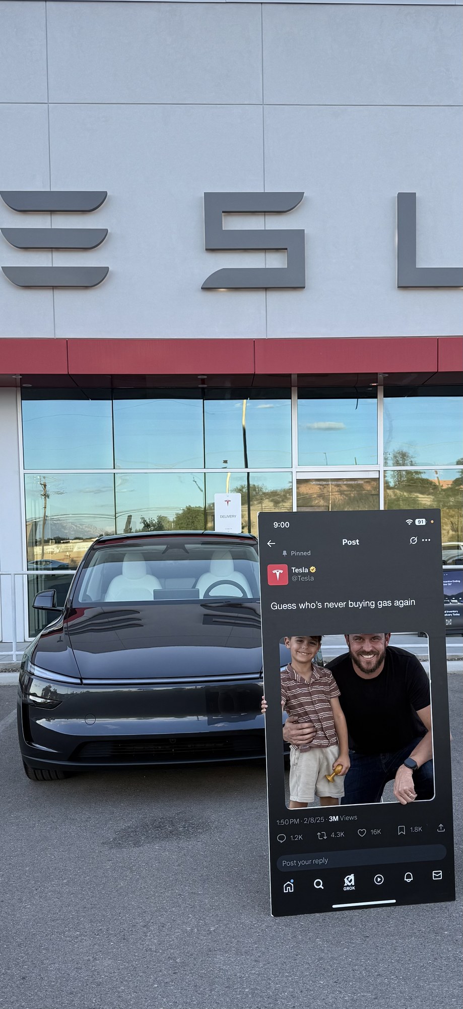 Christopher Maddox and his son celebrating delivery of a new Tesla